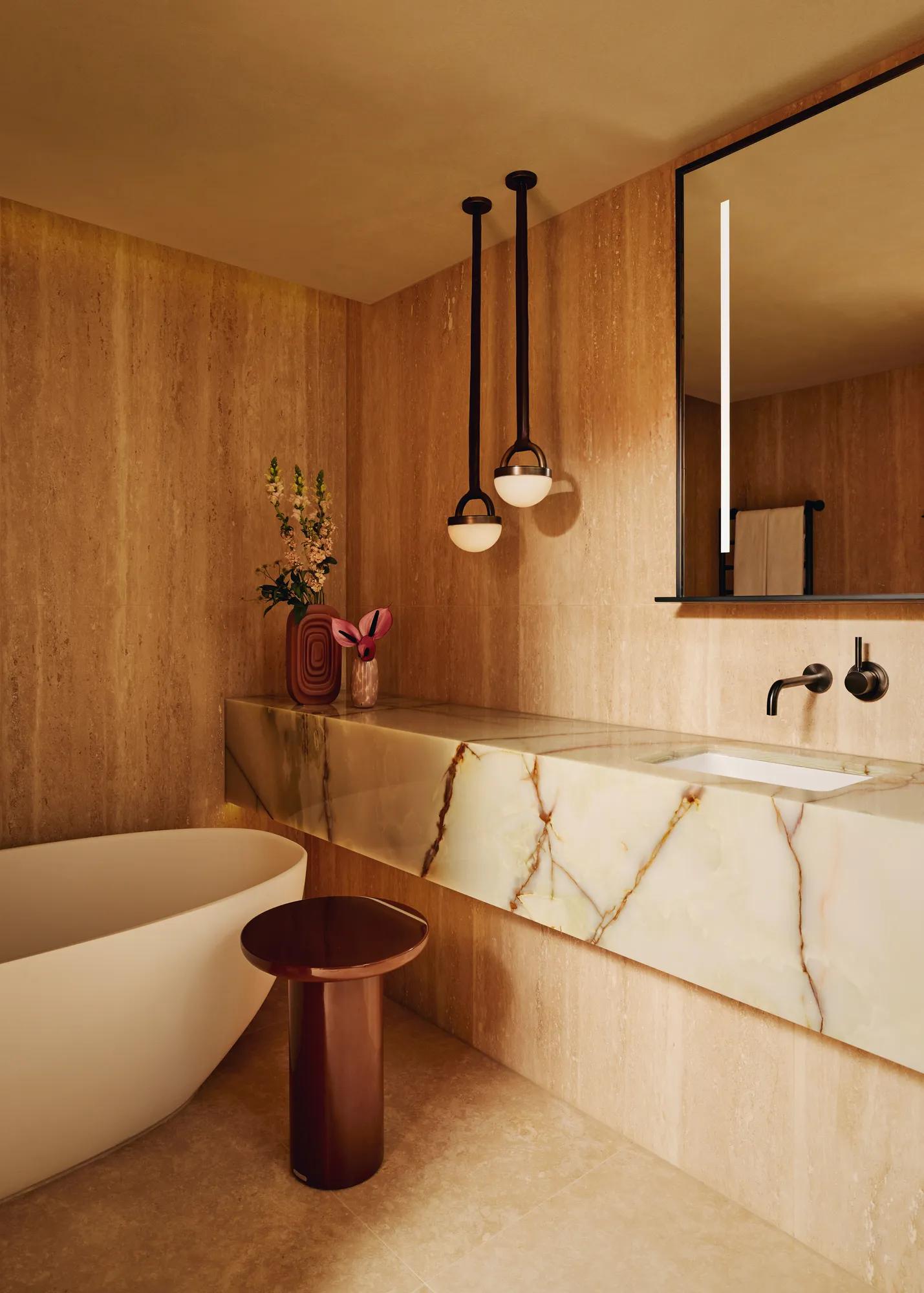 A modern bathroom featuring white marble walls, countertops, and flooring.