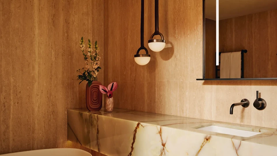 A modern bathroom featuring white marble walls, countertops, and flooring.