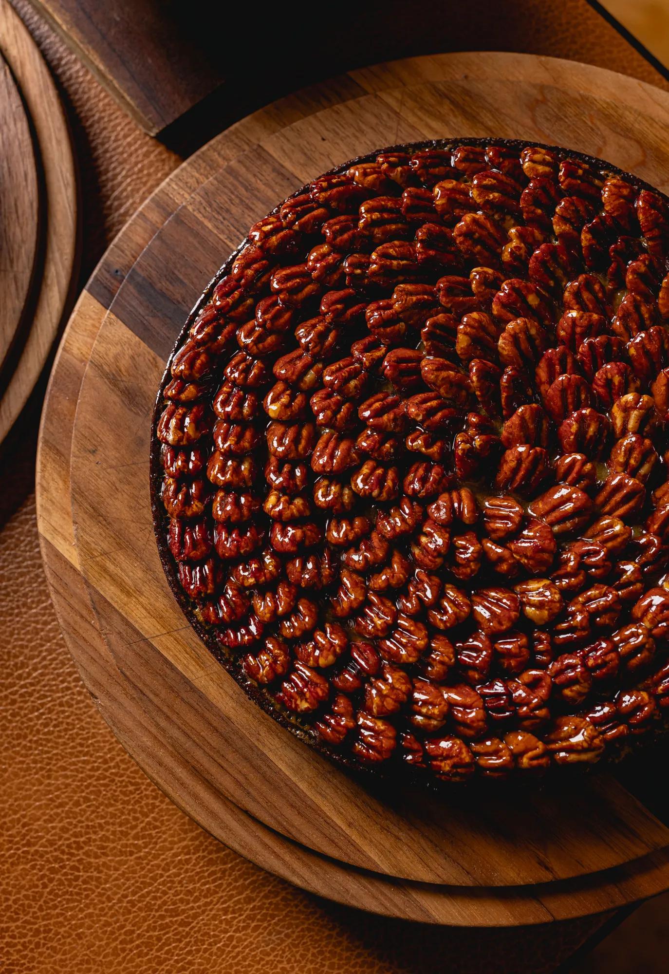 A pecan pie with pecans decorated on top