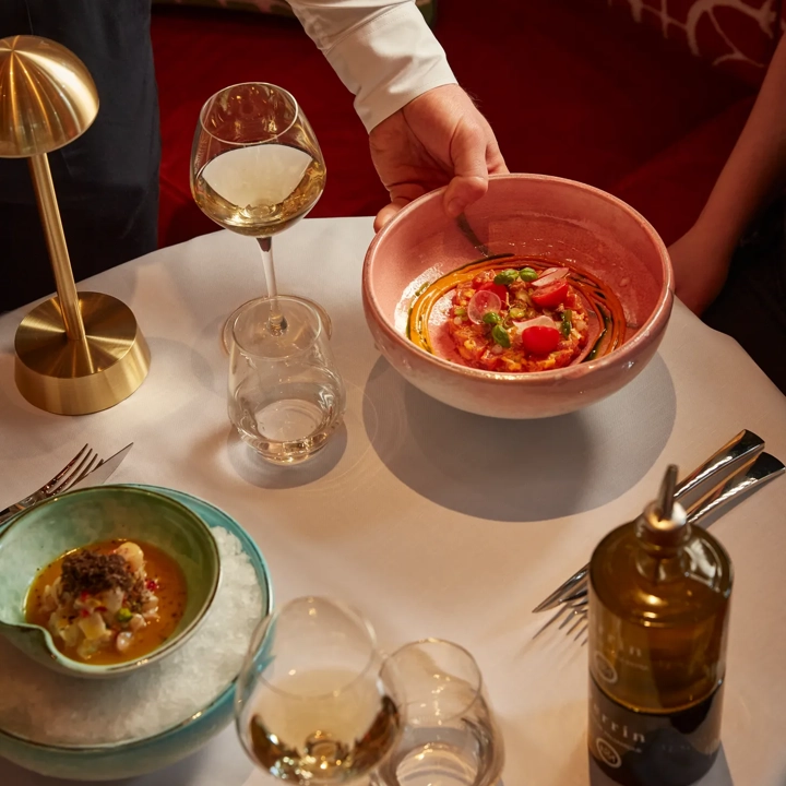 A table set with a variety of dishes arranged for a meal.