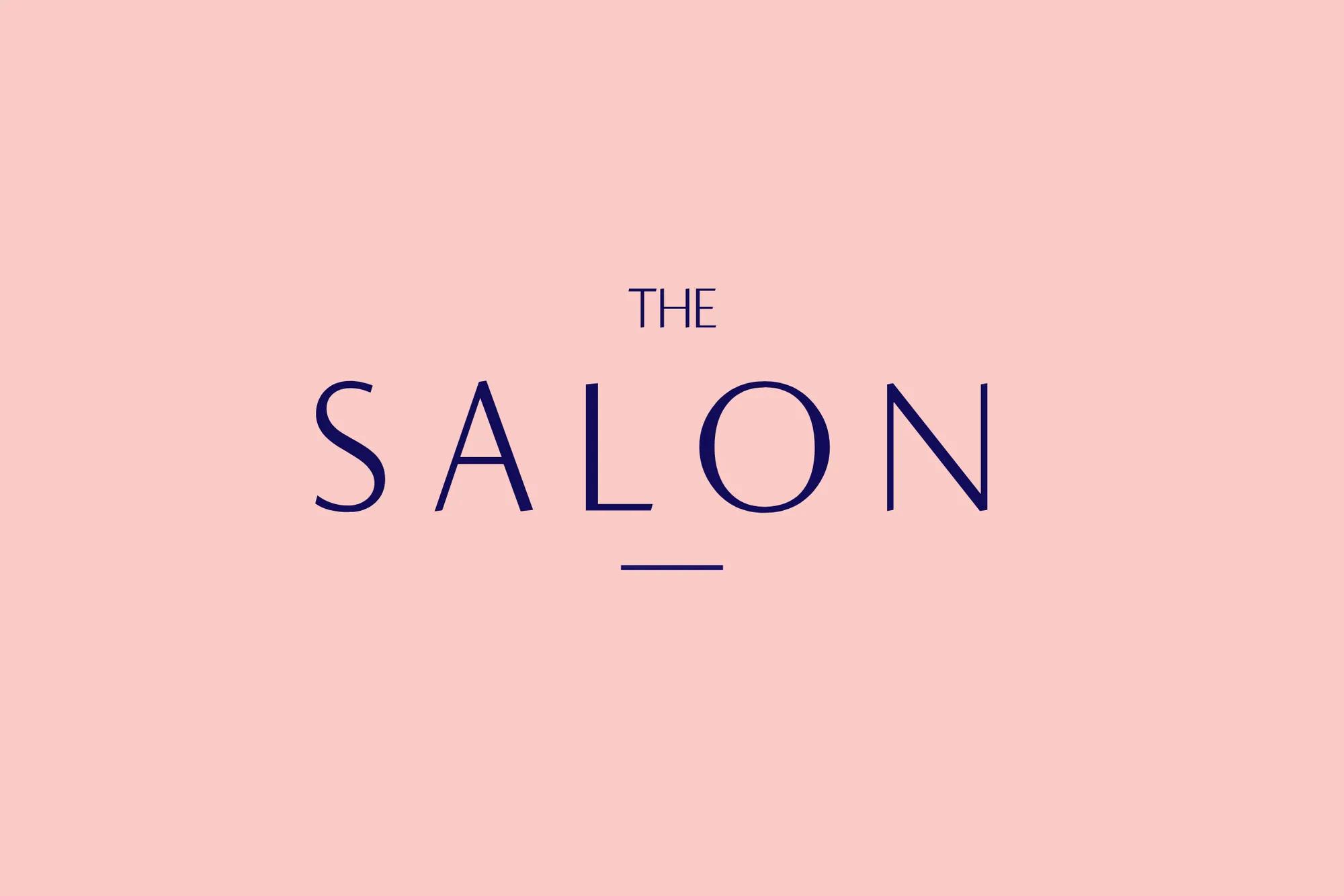 The Salon logo in navy blue text centered on a soft blush pink background, featuring a minimalist and elegant design.