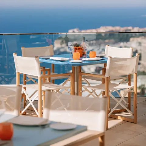 The outdoor pool at Maybourne Riviera, overlooking the Mediterranean, with sleek contemporary design and serene coastal views.