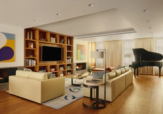A contemporary living room with cream leather sofas, wooden flooring, built-in shelving with a large TV, abstract artwork, and a grand piano near the window, softly lit by natural light through sheer curtains.