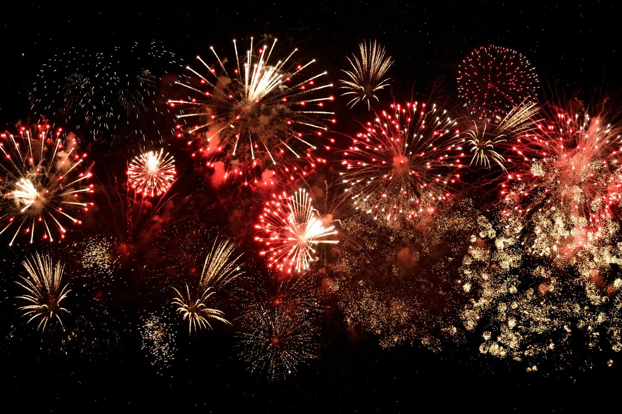 Red fireworks light in the sky