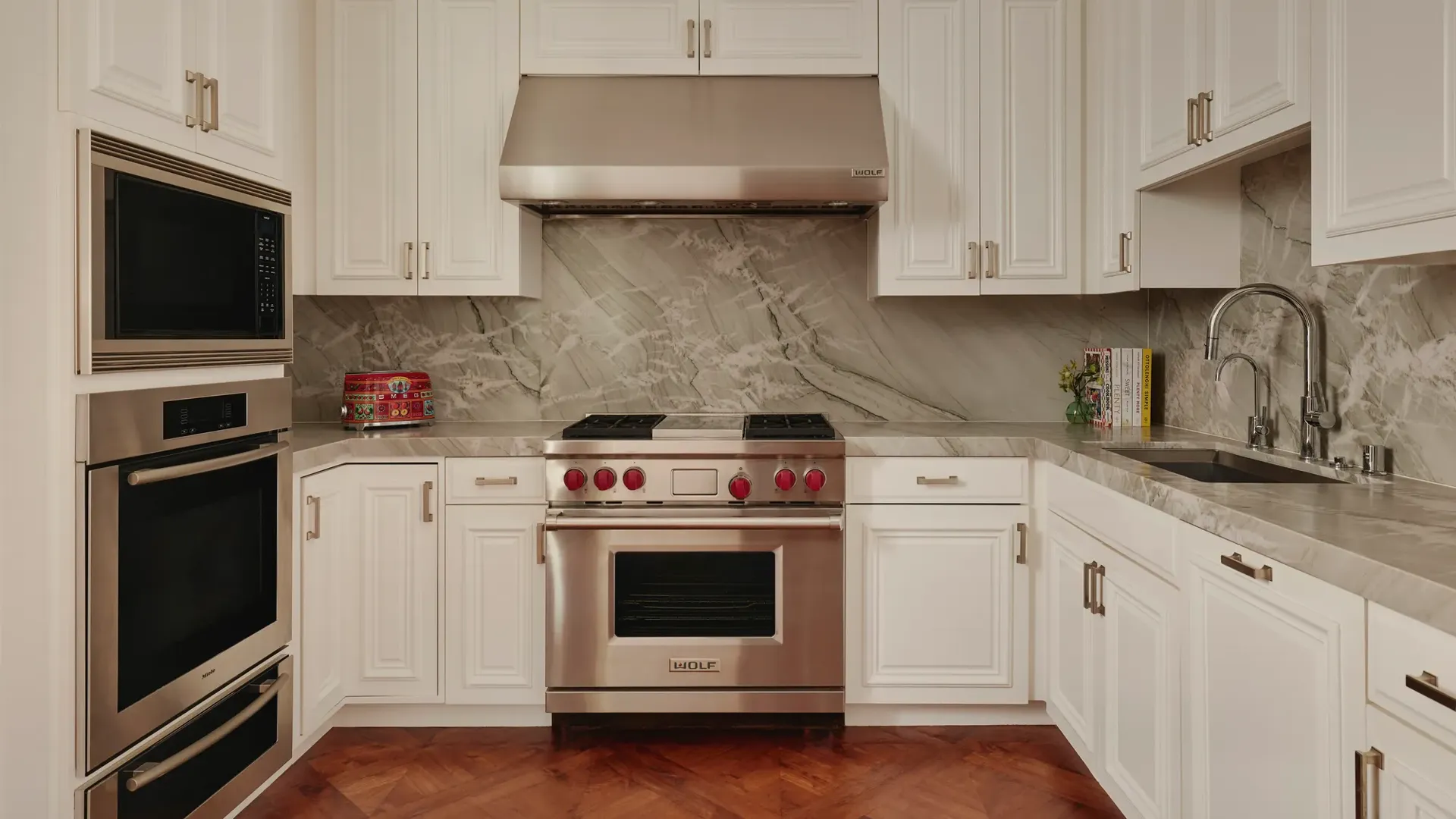 Modern kitchen in the Beverly Three-Bedroom Residence, with sleek cabinetry, premium appliances, and a breakfast bar.