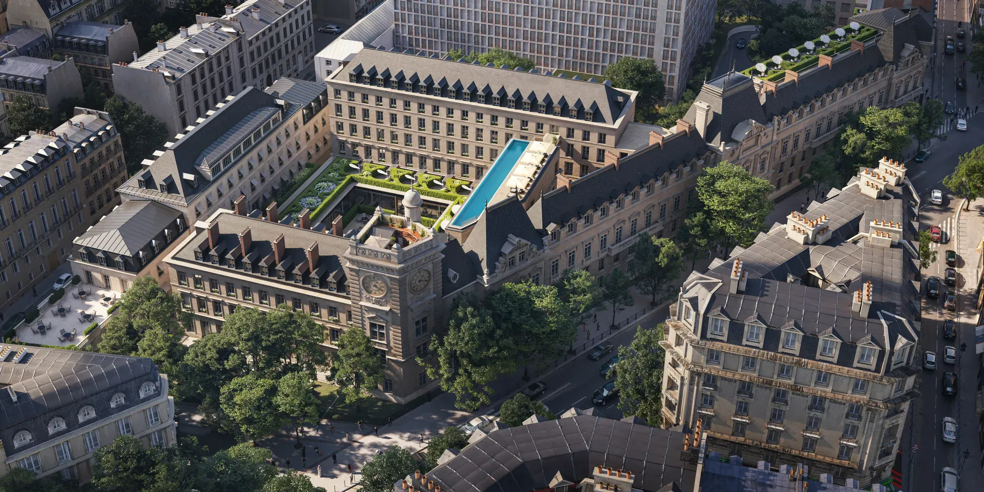 Aerial view of a historic city block with central courtyard garden, rooftop pool and surrounding stone buildings