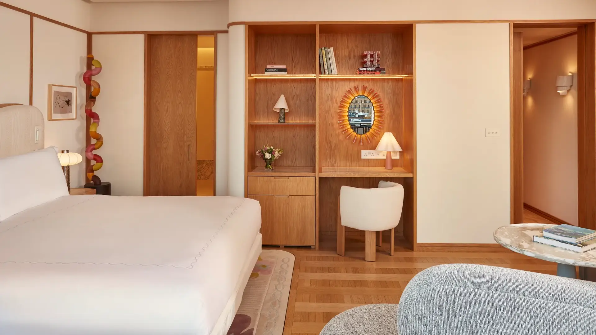 A Mayfair Balcony Room at Claridge’s featuring elegant contemporary décor, soft natural light, and access to a private balcony overlooking the surrounding neighbourhood.