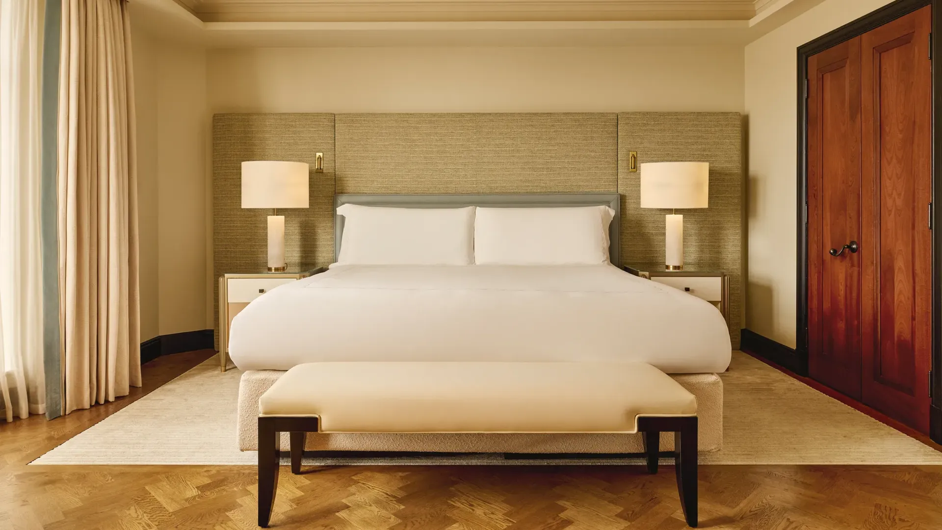 A Corner Terrace Suite at Claridge’s, featuring elegant contemporary décor and a private terrace offering elevated views across Mayfair.