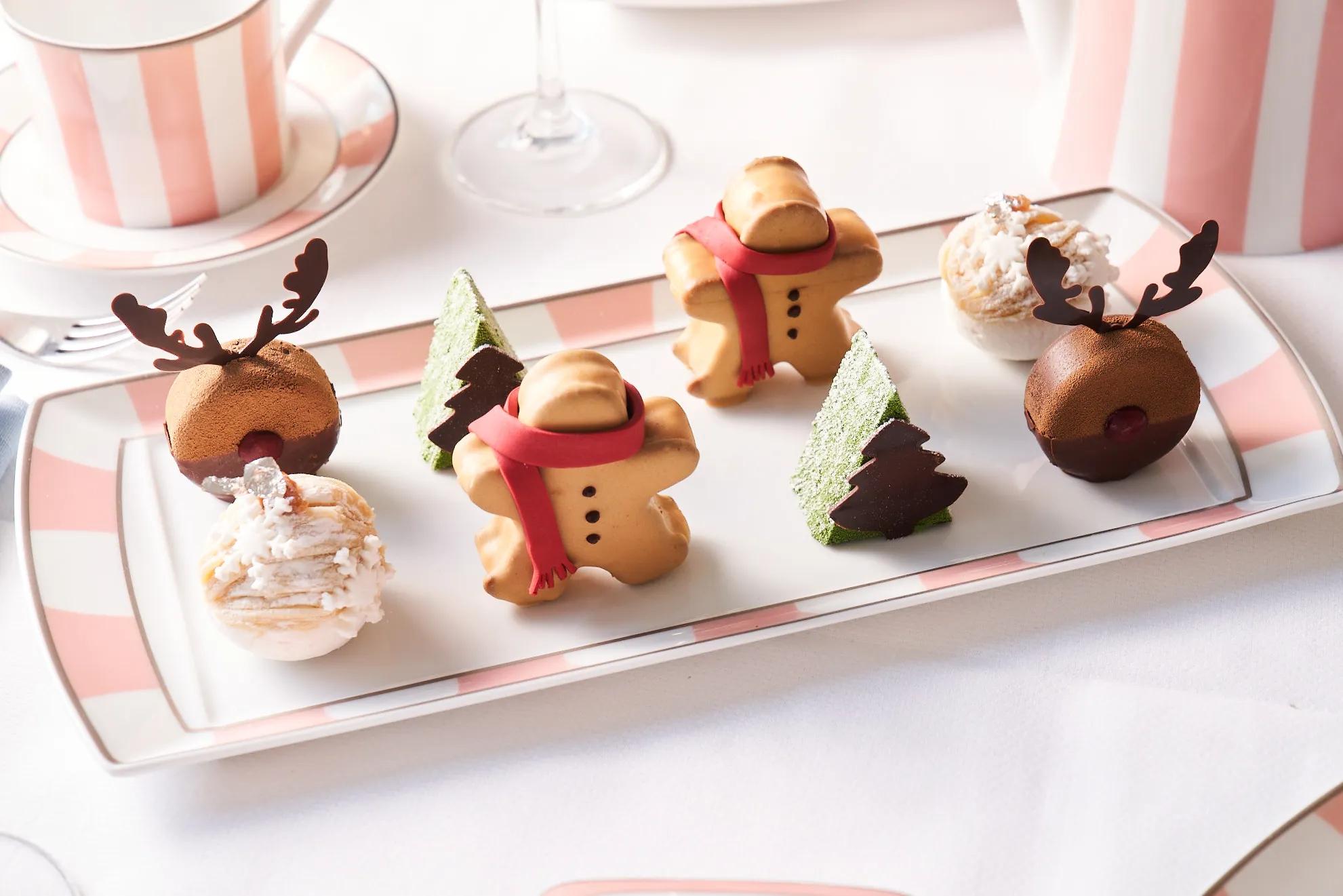 Festive pastries shaped like gingerbread men, reindeer, and trees served at Maybourne Beverly Hills afternoon tea.