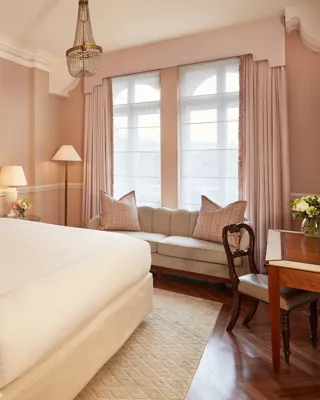 The Mayfair Room at Claridge’s, styled for an elegant event with refined décor, soft lighting, and a sophisticated arrangement that highlights the room’s classic architectural details.