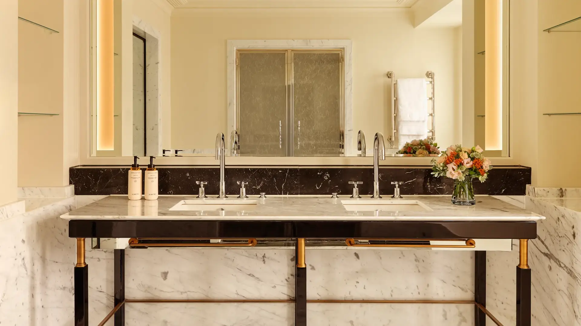 A Corner Terrace Suite at Claridge’s featuring elegant contemporary furnishings, soft natural light, and access to a private terrace with views across Mayfair.