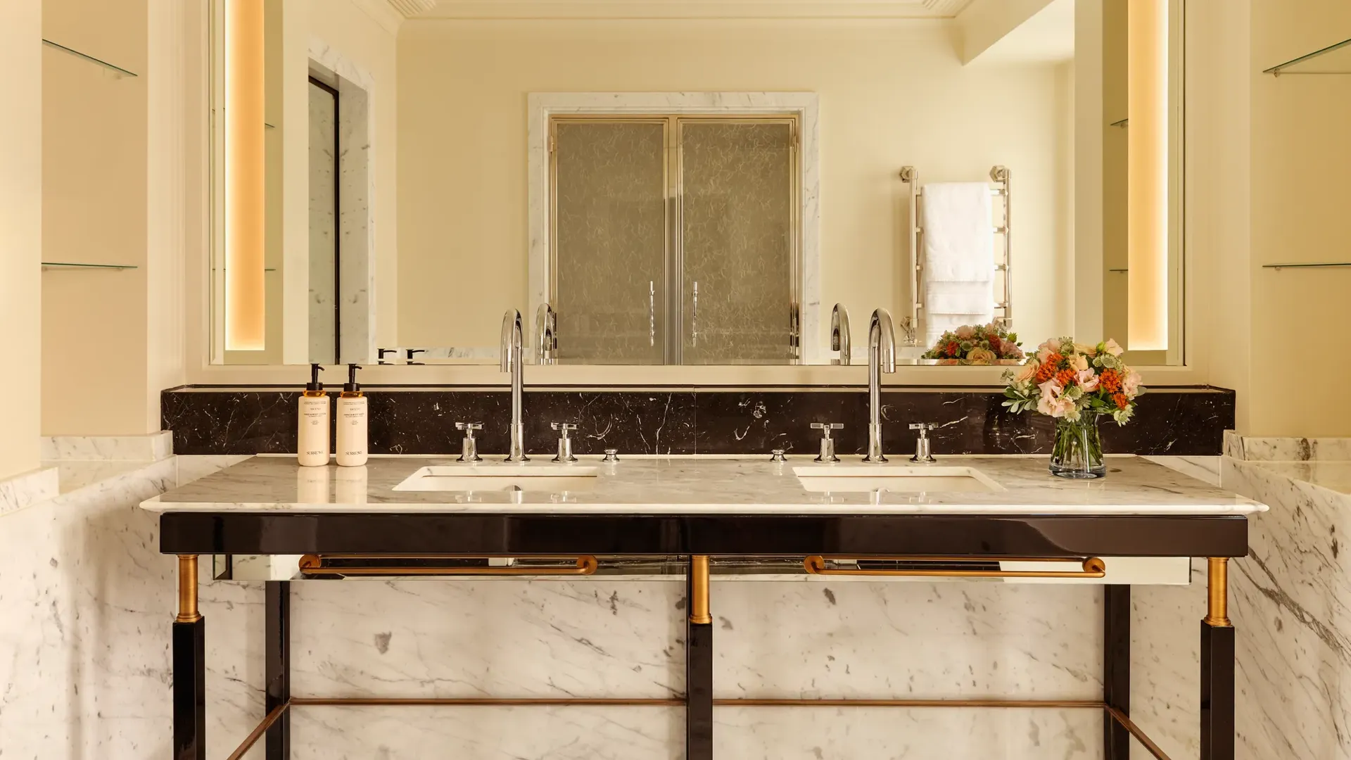 A Corner Terrace Suite at Claridge’s featuring elegant contemporary furnishings, soft natural light, and access to a private terrace with views across Mayfair.