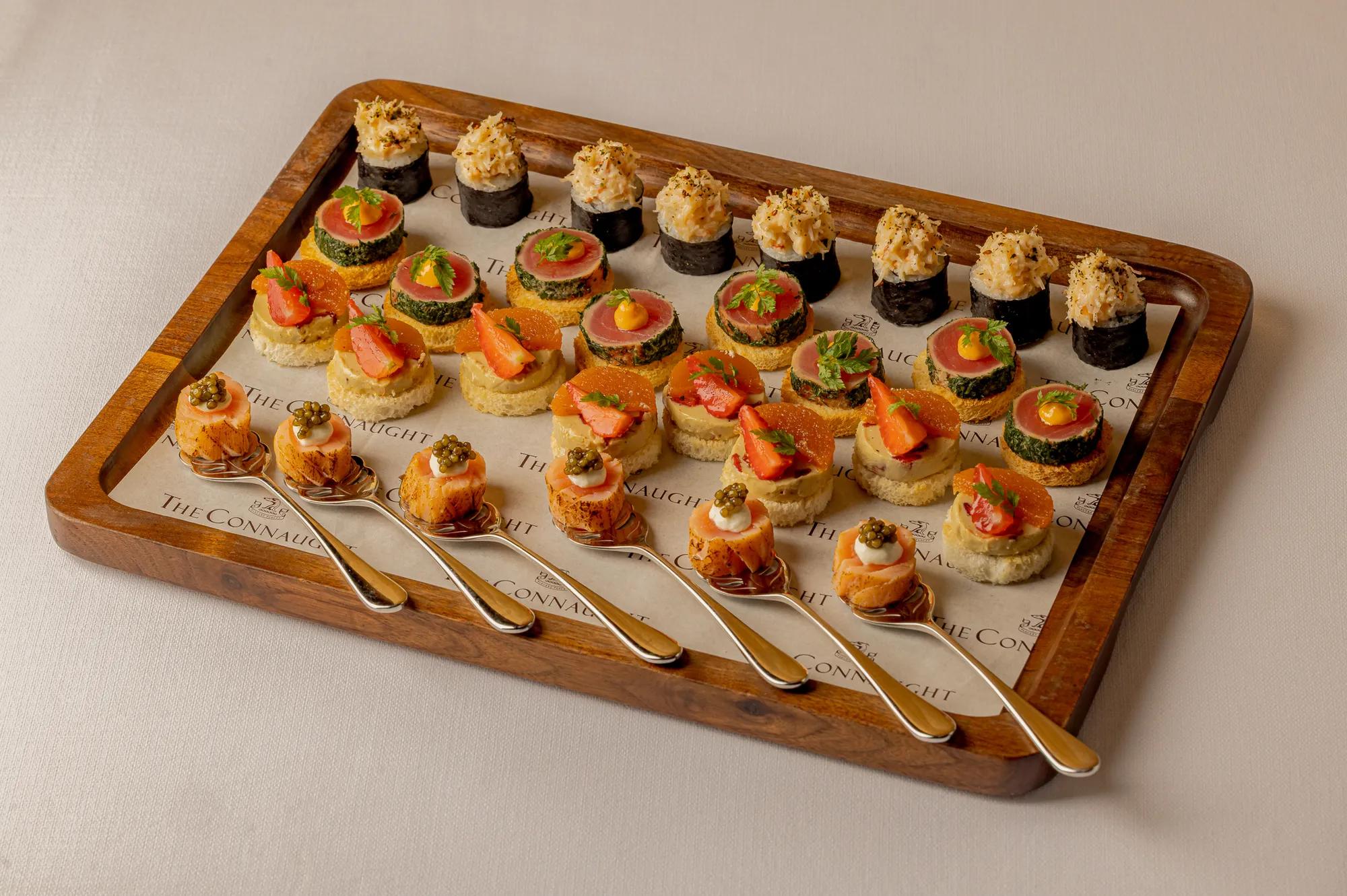 An elegant selection of canapés served for a private event at Claridge’s, arranged with refined presentation and vibrant ingredients on a stylish display.