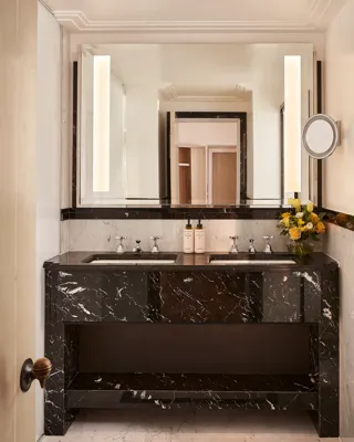 soft ambient lighting, and a sophisticated layout that highlights the room’s classic architectural details.