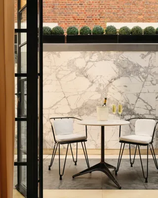 A stylish interior view of The Mews at Claridge’s, featuring refined contemporary design and luxurious detailing