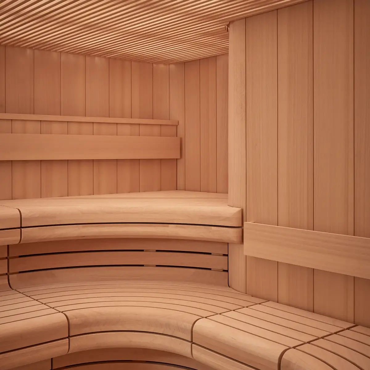 Curved wooden sauna interior with tiered bench seating and slatted walls and ceiling.