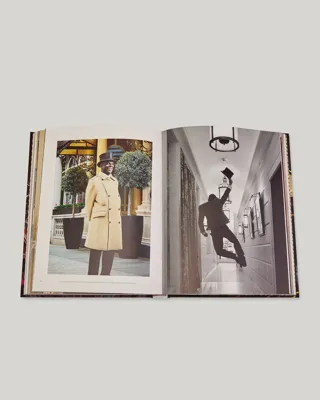 Open book spread with a colour portrait of a Connaught doorman and a black-and-white image of staff adjusting a corridor light.