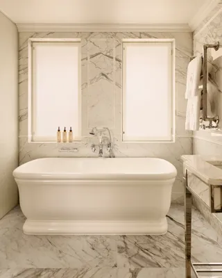 A luxurious bathroom in the Claridge’s corner suite, featuring elegant marble surfaces, polished fixtures, and a serene, spa‑like design.A luxurious bathroom in the Claridge’s corner suite, featuring elegant marble surfaces, polished fixtures, and a serene, spa‑like design.