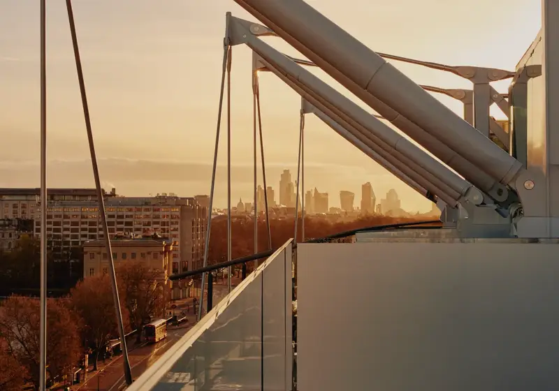 Architectural roof beams and skyline views from The Emory at dusk.