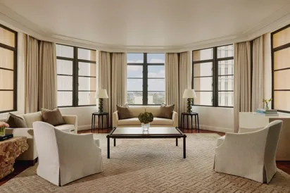 Light-filled open-plan living area in the Beverly Three-Bedroom Residence, with designer furniture and a spacious layout.