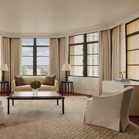 Light-filled open-plan living area in the Beverly Three-Bedroom Residence, with designer furniture and a spacious layout.