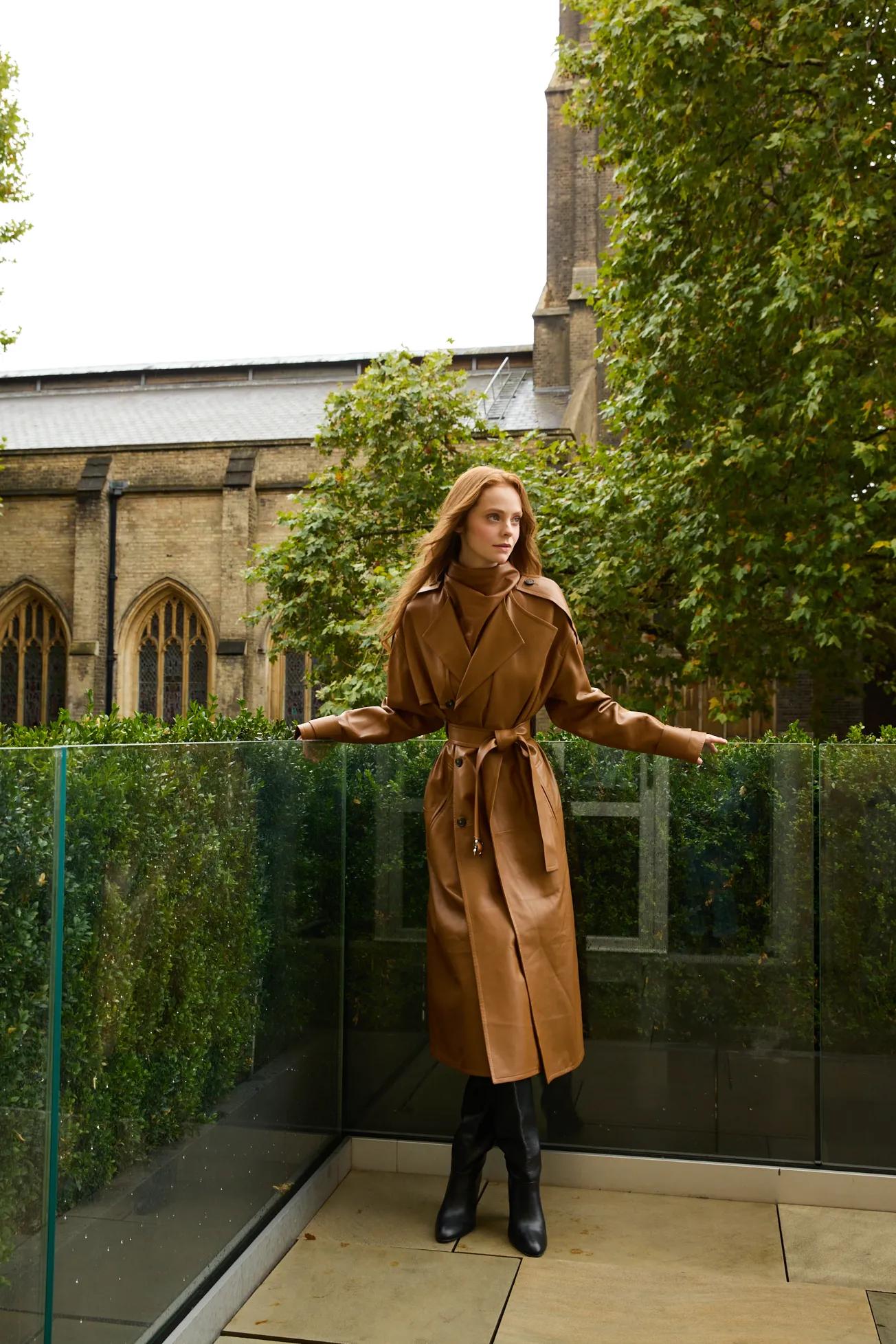 Guest standing on a private terrace at The Berkeley, overlooking leafy London streets and historic architecture.