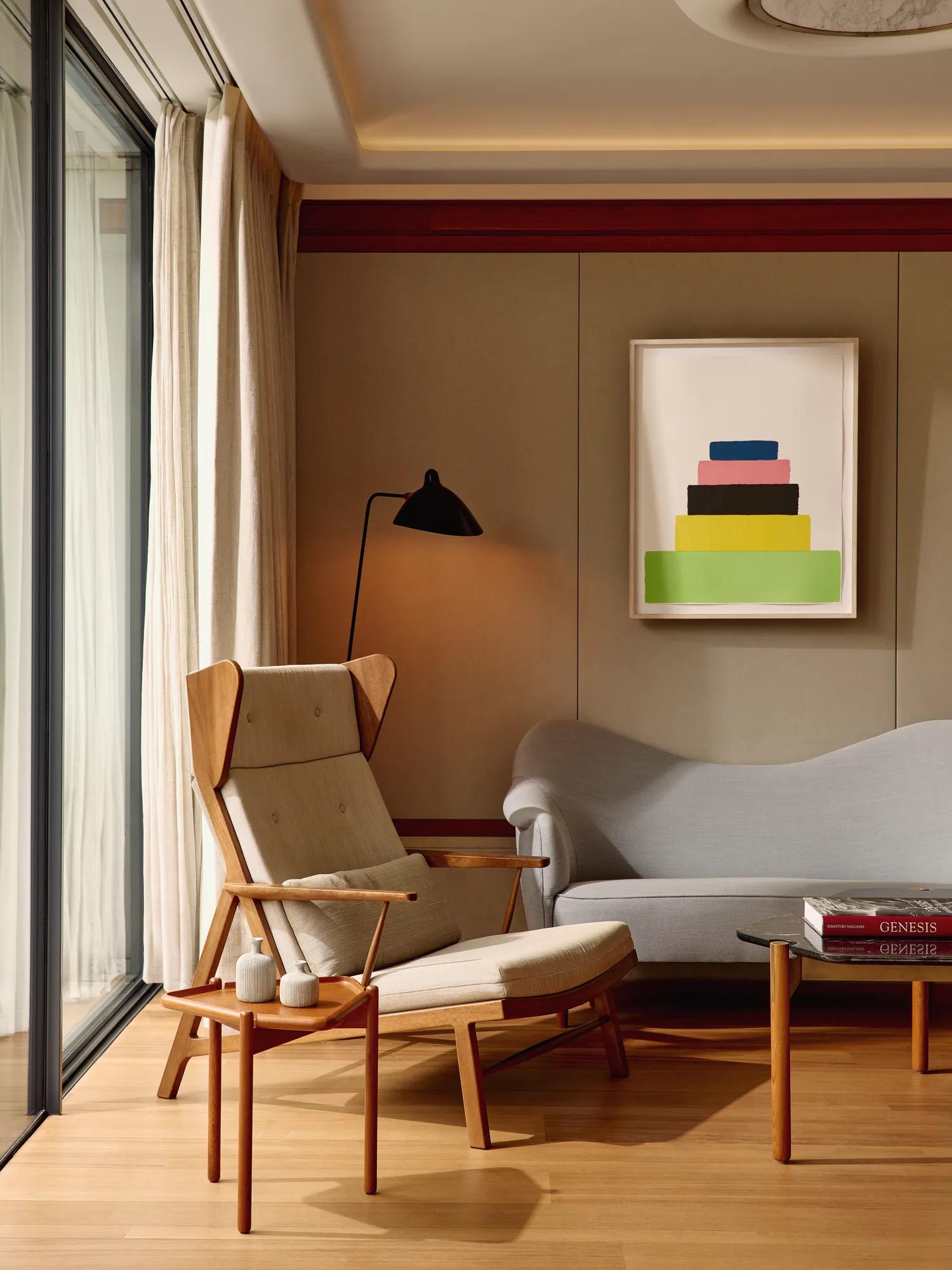 Bright living room with a sofa, soft natural light, and a calm, inviting atmosphere.
