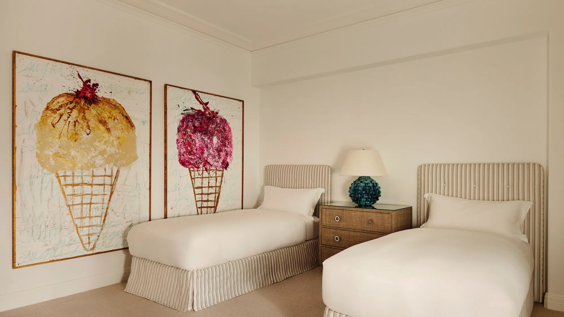 Bathroom in the Beverly Three-Bedroom Residence, showcasing marble finishes, a walk-in shower, and a deep soaking tub.