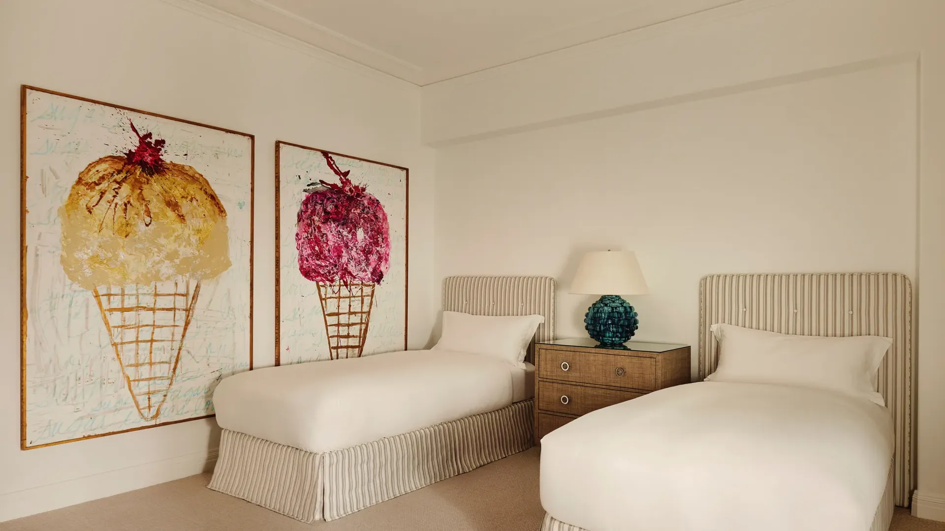 Bathroom in the Beverly Three-Bedroom Residence, showcasing marble finishes, a walk-in shower, and a deep soaking tub.