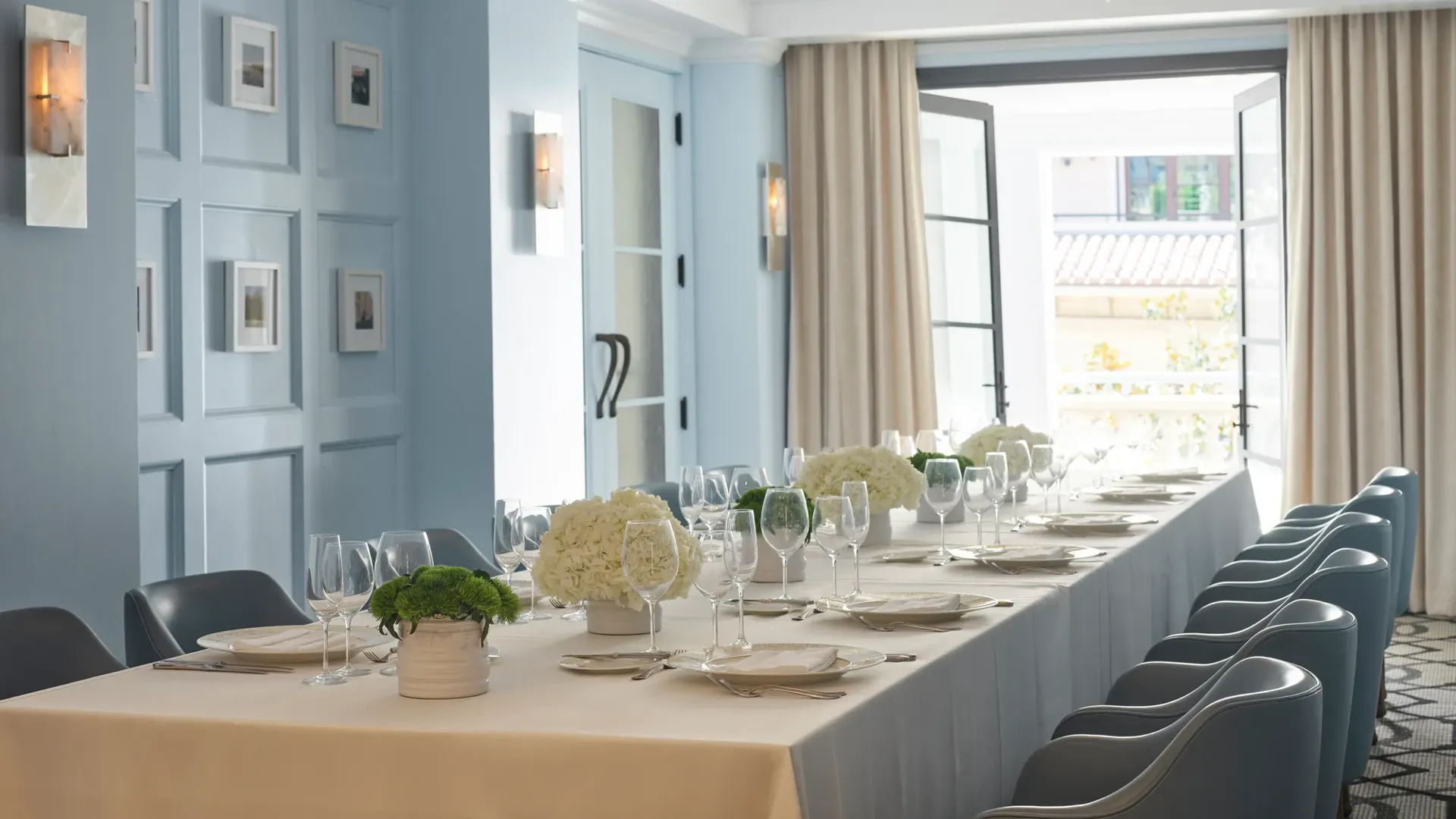 Canon Room private dining table set beside open French doors to terrace.