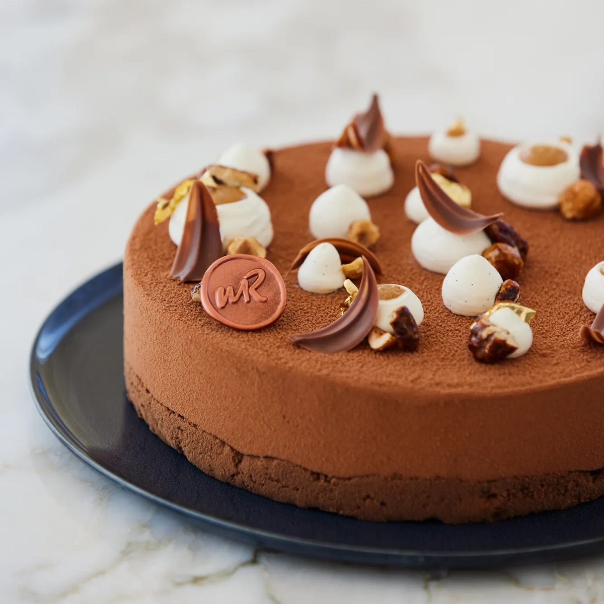 An elegant selection of pâtisserie items from the Claridge’s collection, beautifully arranged to highlight refined craftsmanship and delicate details.