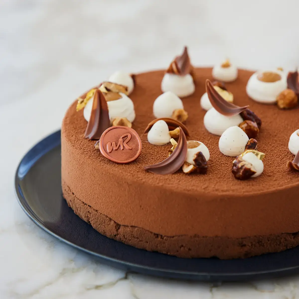 An elegant selection of pâtisserie items from the Claridge’s collection, beautifully arranged to highlight refined craftsmanship and delicate details.