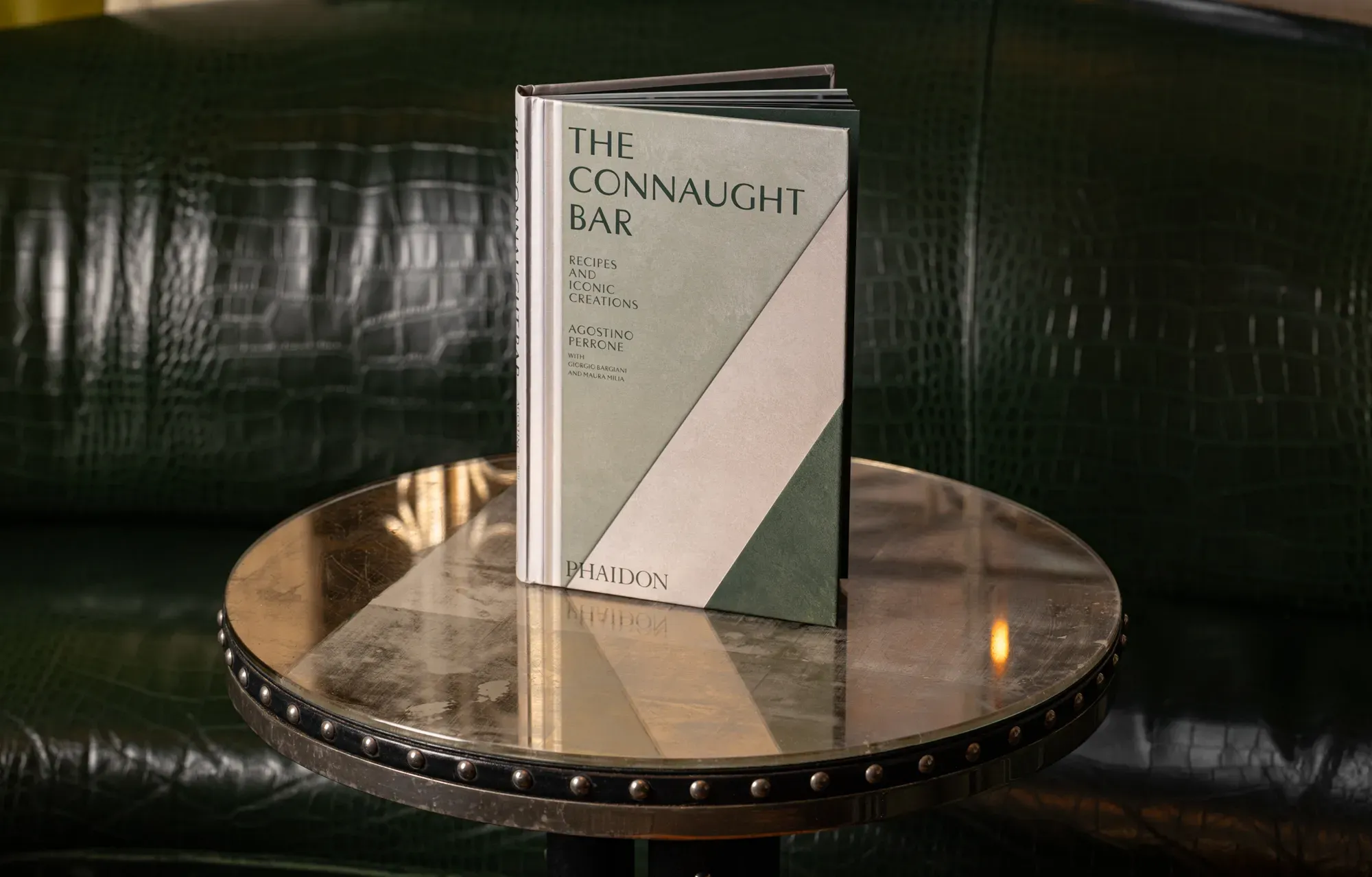 The Connaught Bar book resting on a table, its dark cover and elegant typography clearly visible.
